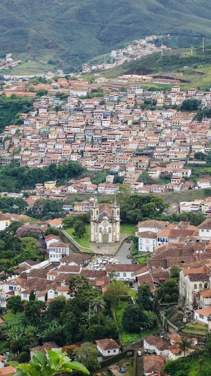 Small town in the mountains with chuch in the middle