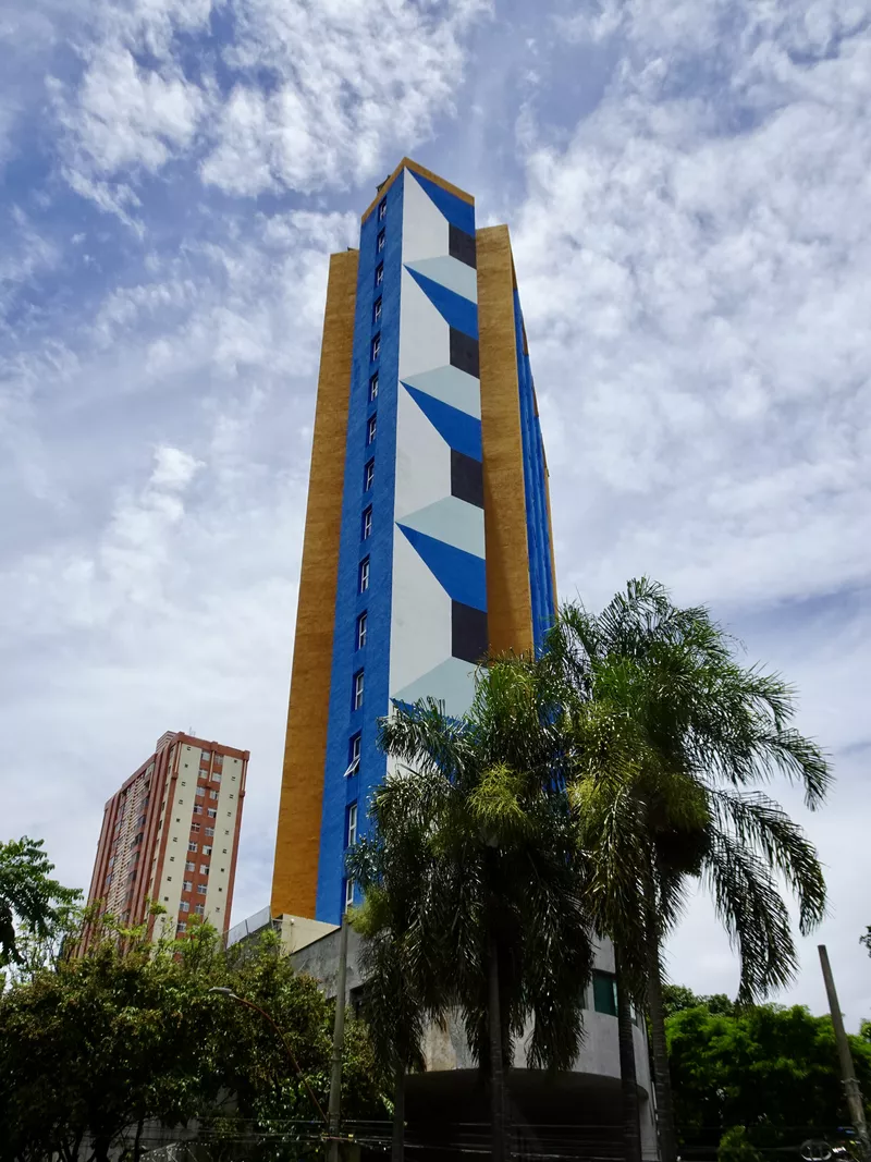 Tall and colorful mural on a big building